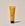 A yellow tube of ACURE Brightening Cleansing Gel on a neutral background.